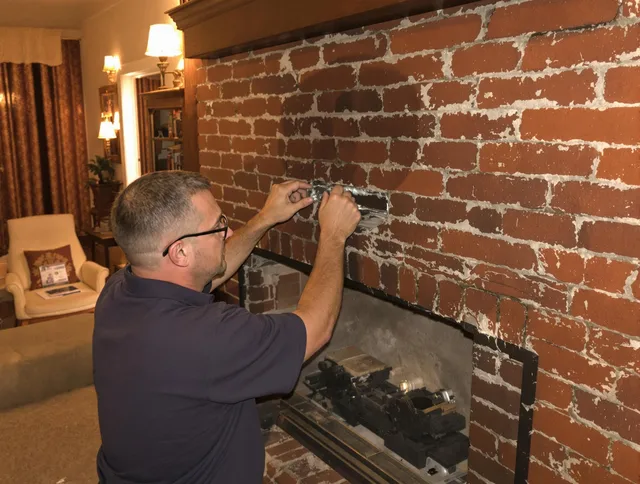Cheshire Chimney Sweep expert fixing a fireplace in Cheshire, CT